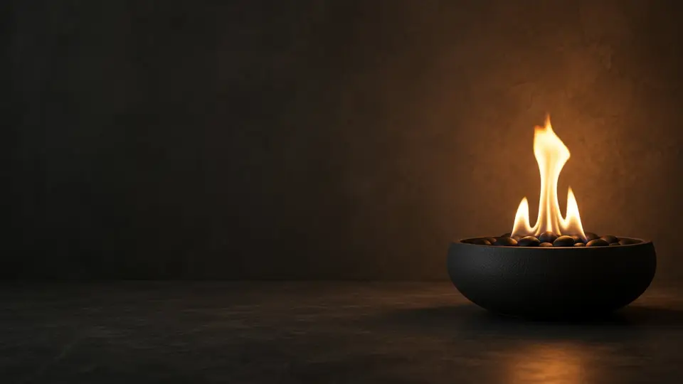 A single flame dances in a dark bowl against a calm, warm backdrop.