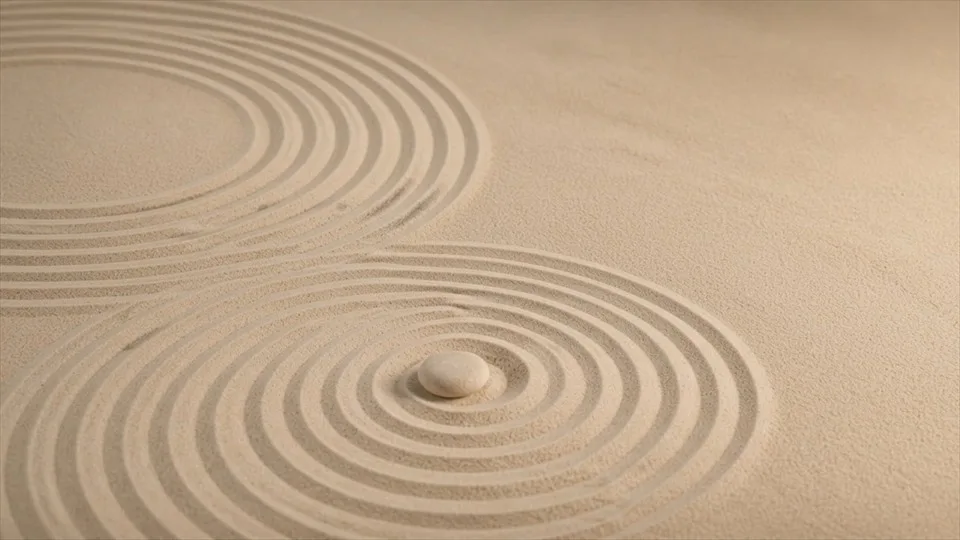 Concentric patterns move slowly across fine sand.