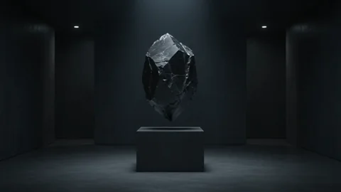 Black-Orbit 2. A levitating black crystal rotates in a cinematic light installation