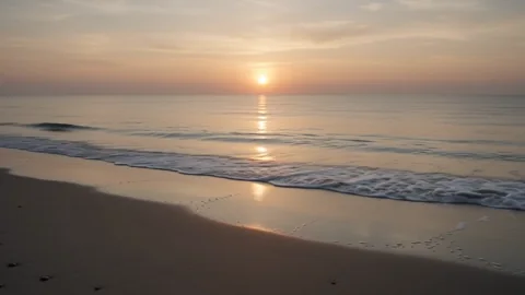 Golden Shore 1. Gentle ocean waves move through warm sunset light.